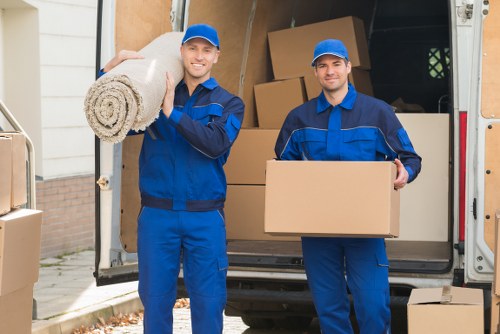 Removal workers loading furniture for a Ruislip home move