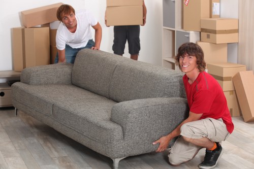Staff handling furniture carefully during a man and van move in Ruislip