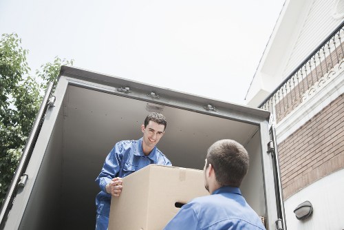 Careful loading of boxes and household items into a van in Ruislip