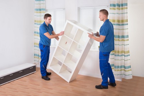 Professional moving team loading boxes into a removal van in Ruislip