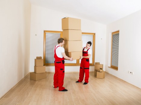 Packing and loading furniture into a removal van